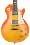 Lzzy Hale Explorerbird Electric Guitar - Cardinal Red vs Limited Edition 1959 Les Paul Standard Electric Guitar - Aged Honey Burst Gloss Sweetwater Exclusive